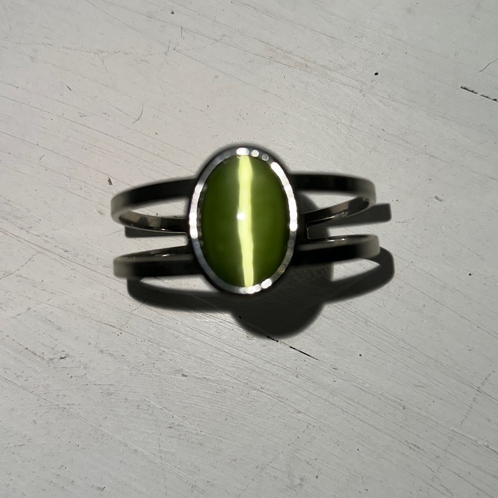 Gently loved silver bracelet with green stone